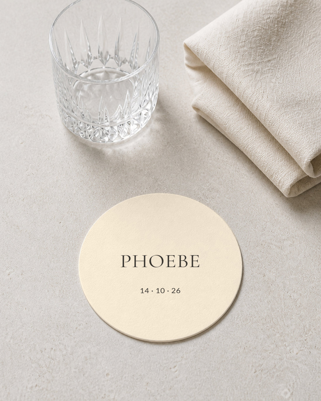 Linen ivory coaster at a place setting