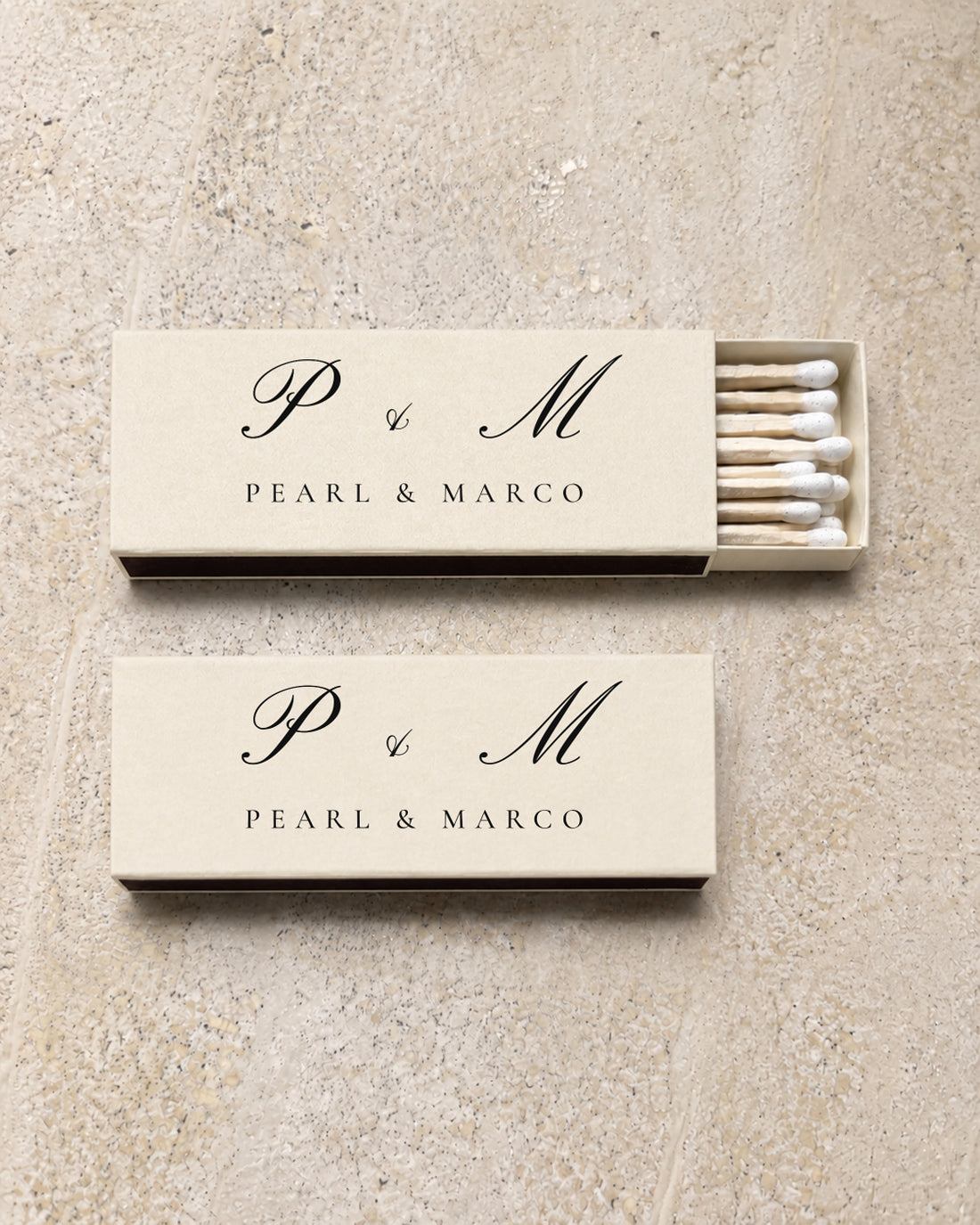 Pearl slim matchbox in ivory, open and closed pair on stone