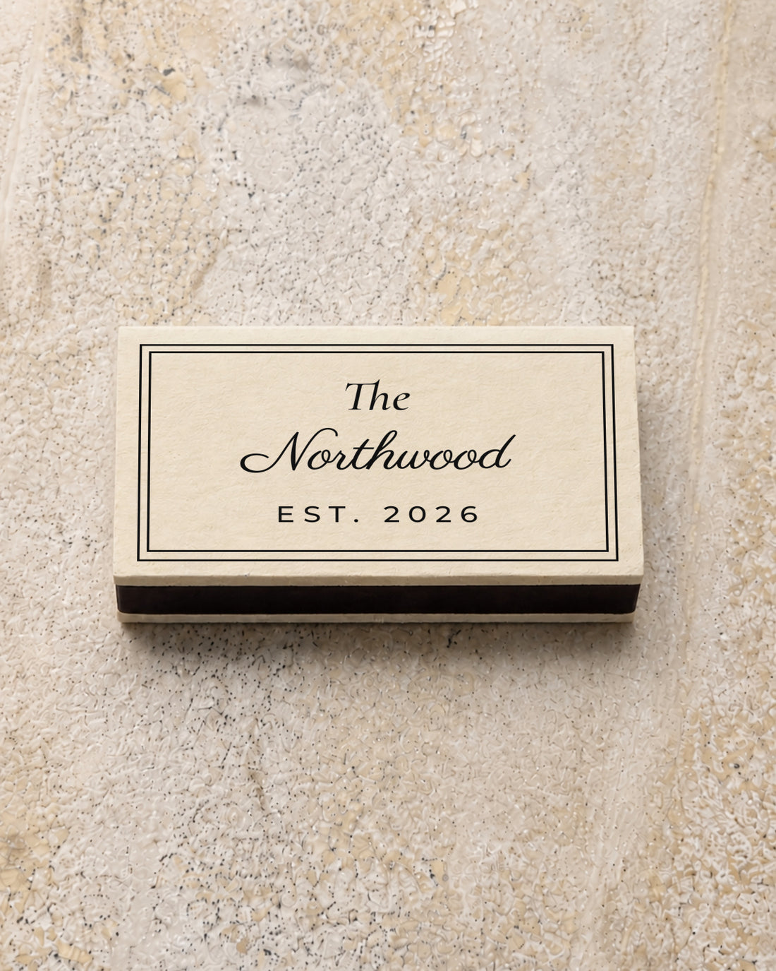 Northwood classic matchbox in ivory, closed on stone