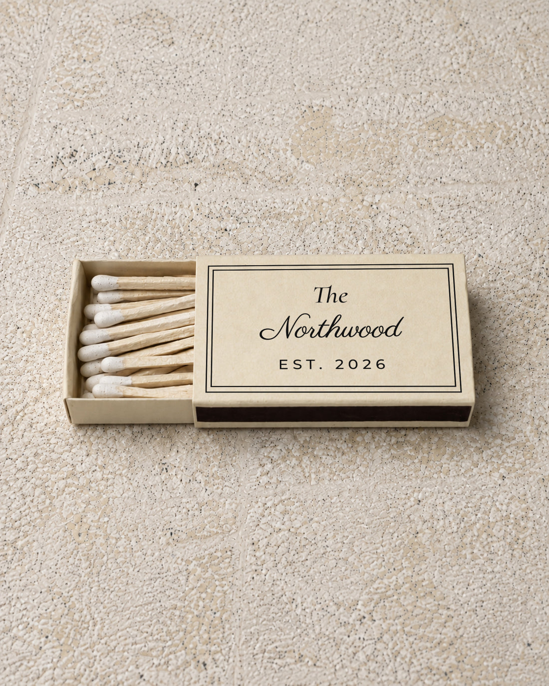 Northwood classic matchbox in ivory, partly open on stone