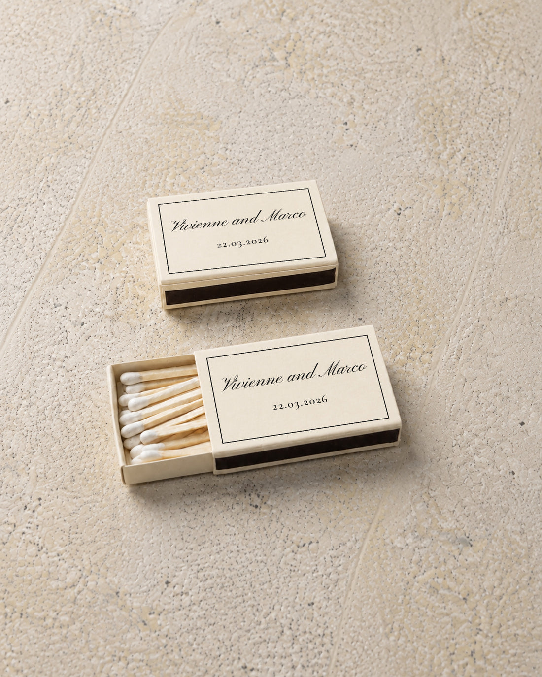 Vivienne classic matchbox in ivory, angled open and closed pair on stone