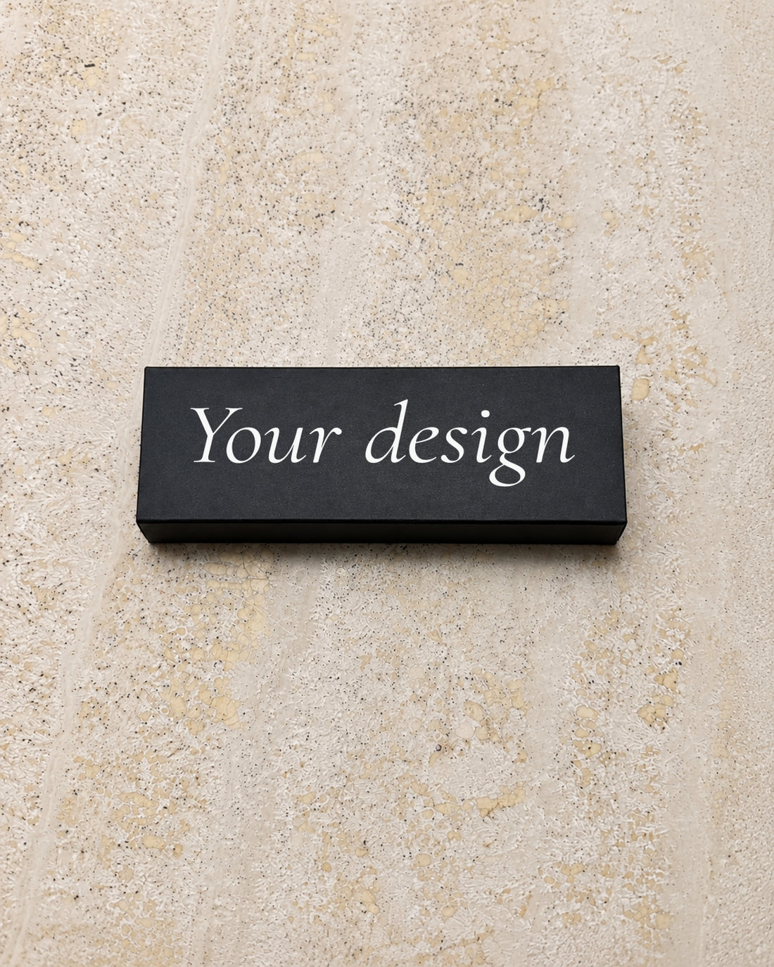 Your Design slim matchbox in black, closed on stone