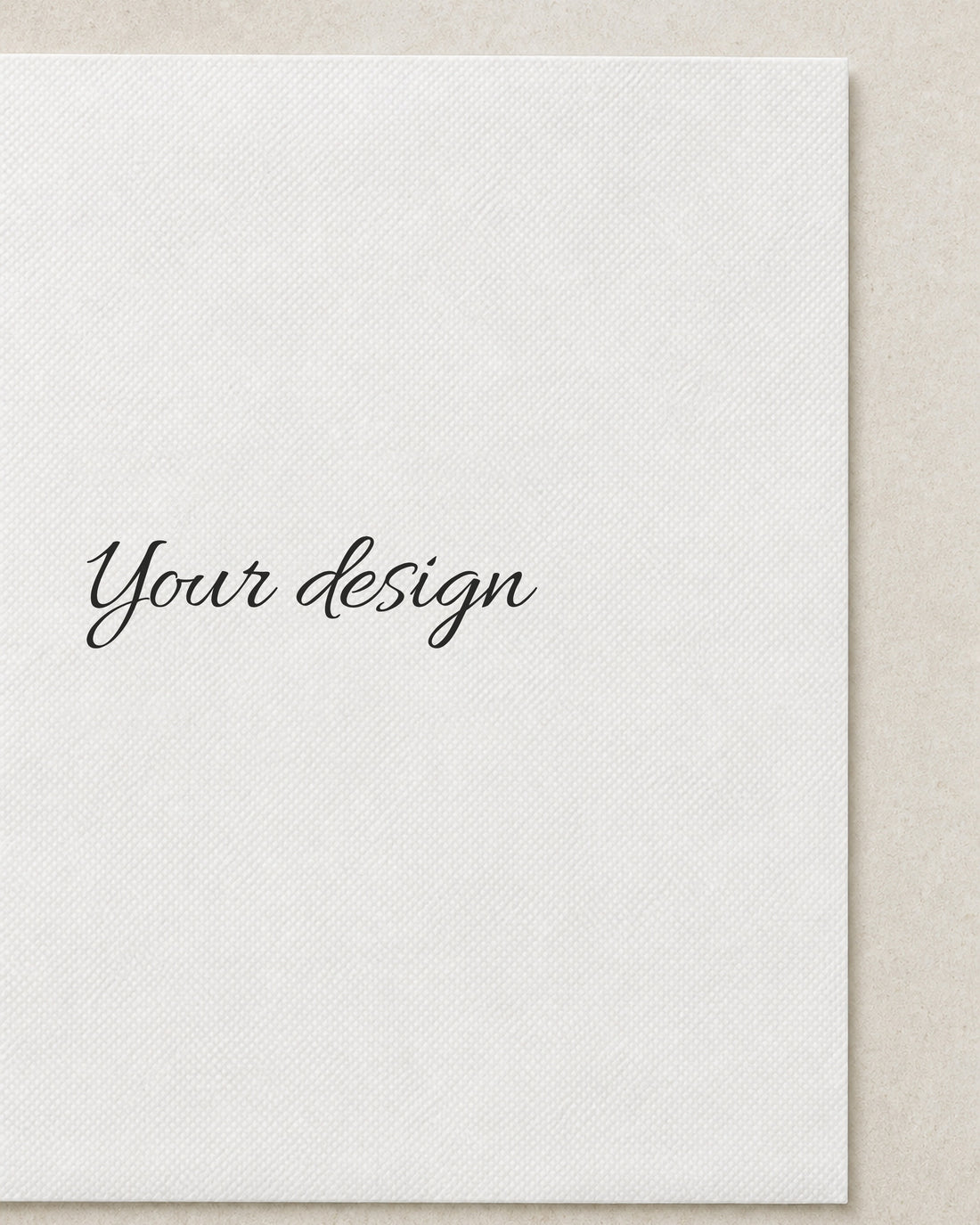 A blank cocktail napkin printed with the words Your design, close detail