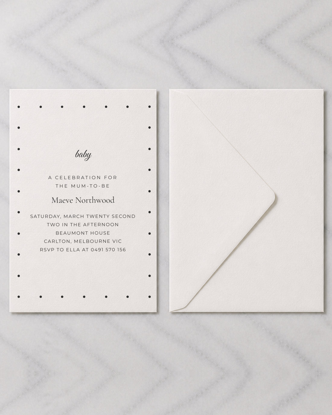 The Marigold baby shower invitation, shown with its envelope