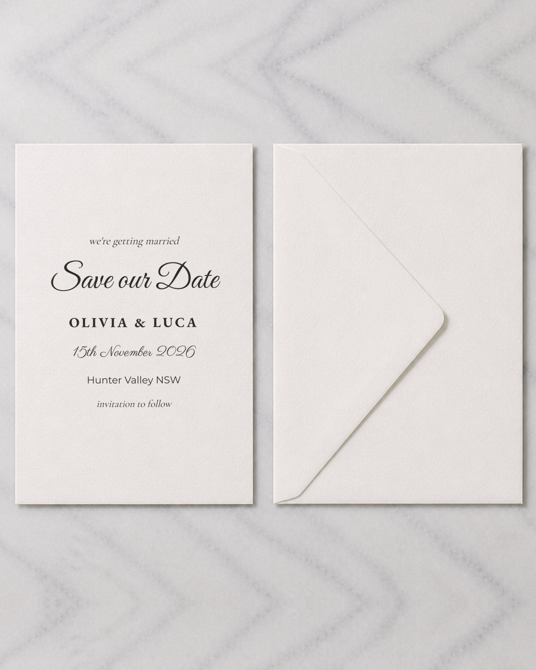 The Nell save the date, shown with its envelope