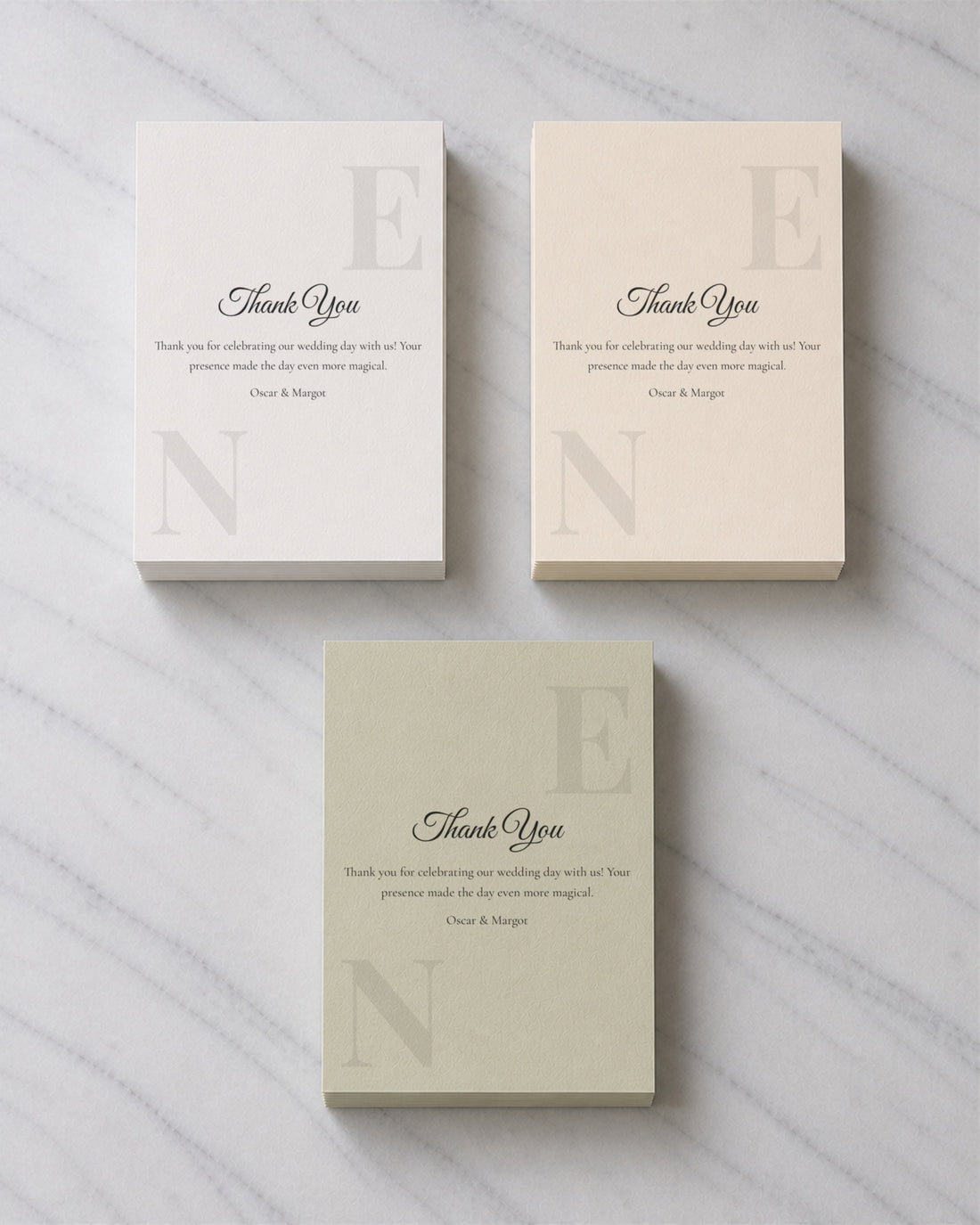 Three stacks of Monogram Script thank you cards in Porcelain, Ivory and Sage Green