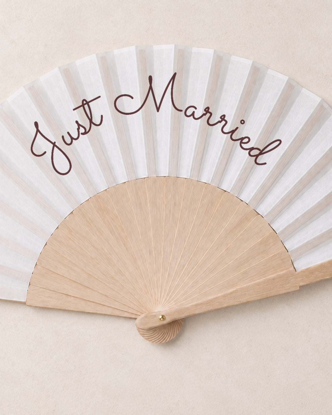 Just Married, close open fan, solid bamboo fan on light marble