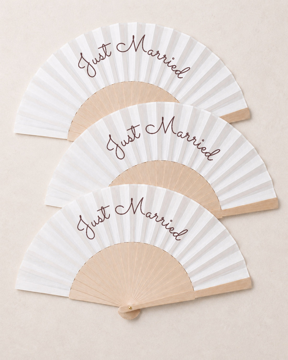 Just Married, three open fans, solid bamboo fan on light marble