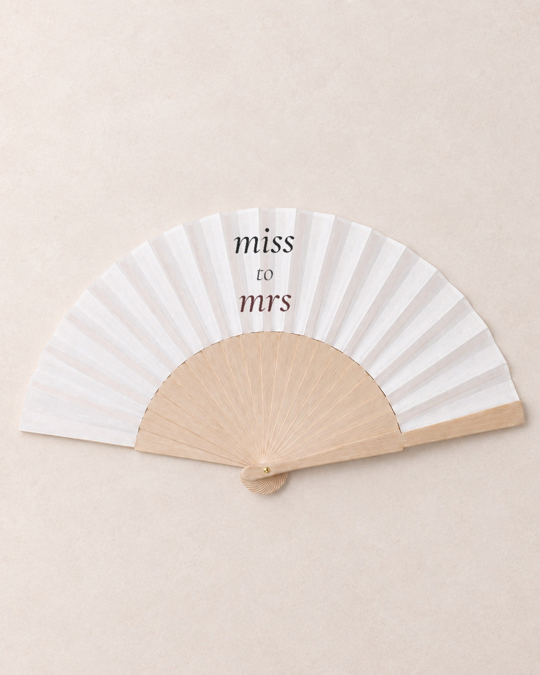 Miss to Mrs, hero, solid bamboo fan on light marble