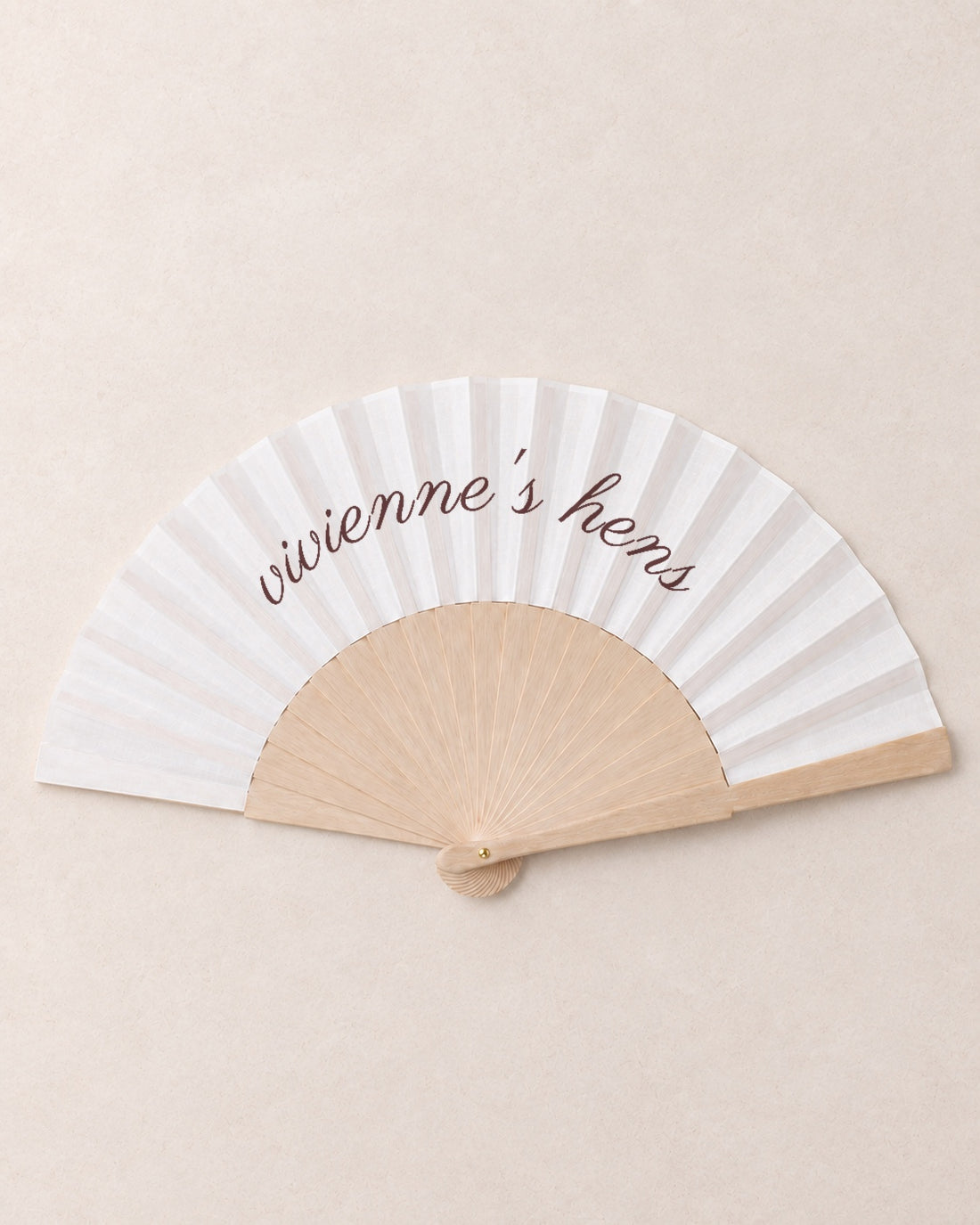 The Hen, hero, solid bamboo fan on light marble