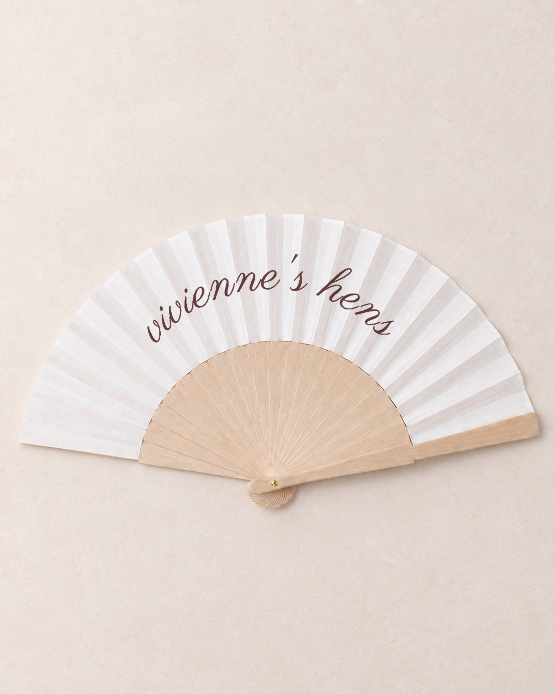 The Hen, hero, solid bamboo fan on light marble