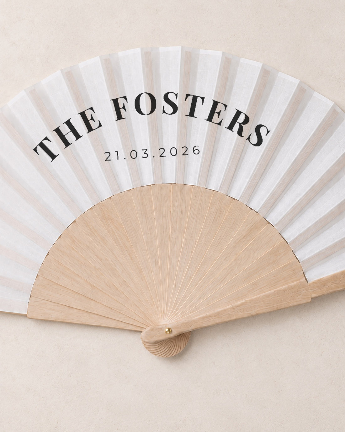 The Name, close open fan, solid bamboo fan on light marble