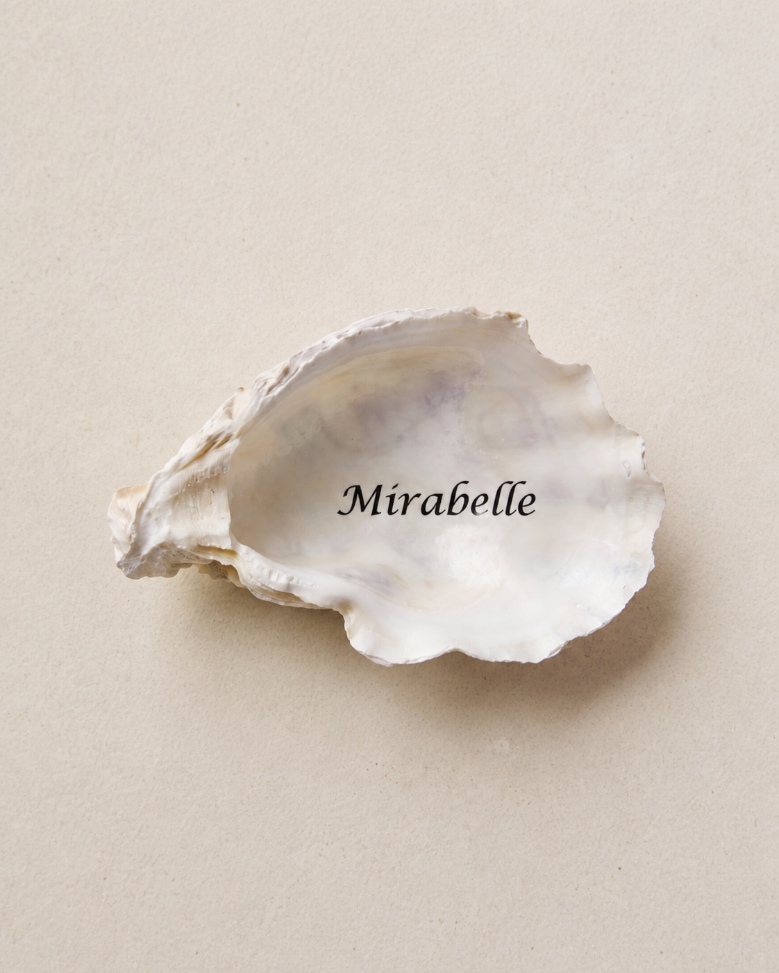 Natural oyster shell place cards, personalised with each guest's name