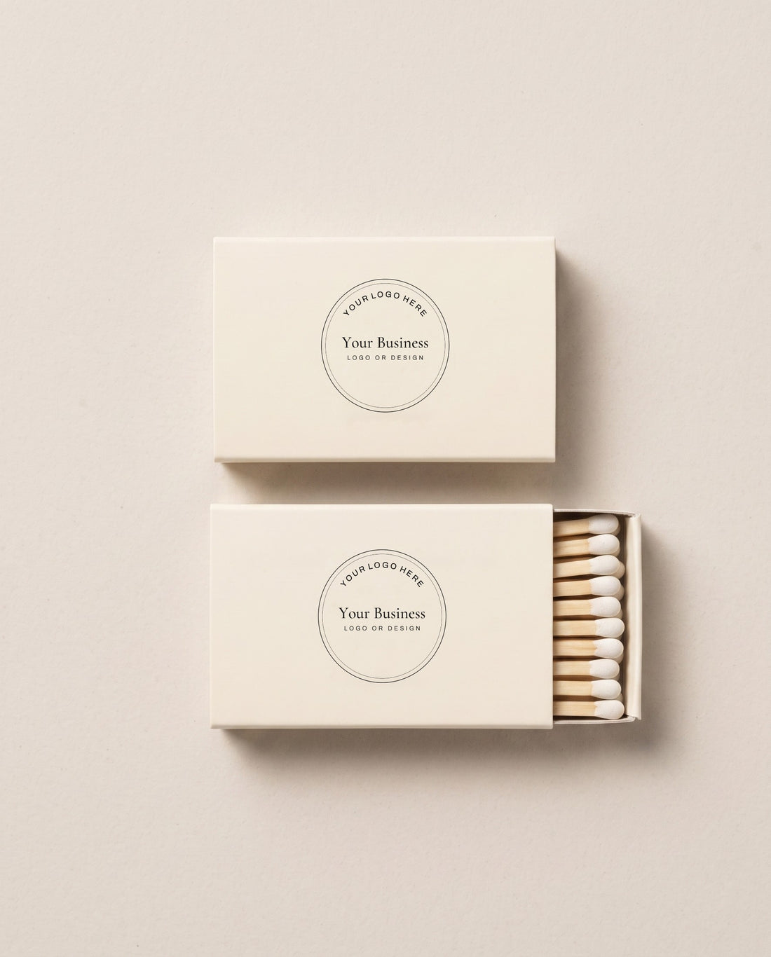 A pair of matchboxes printed with a placeholder business logo
