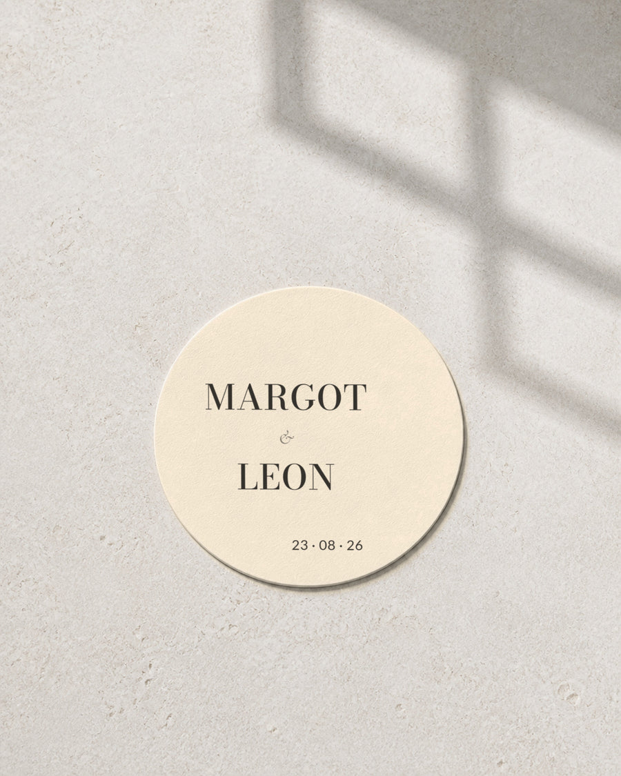 Graphite ivory coaster in window light
