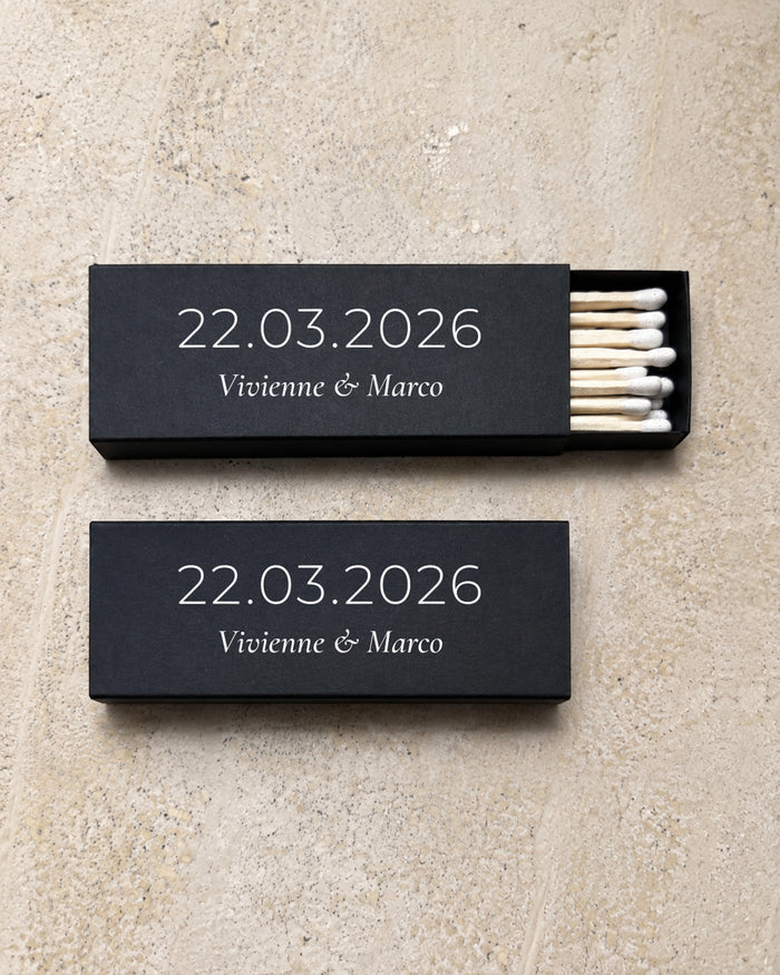Beacon slim matchbox in black, open and closed pair on stone