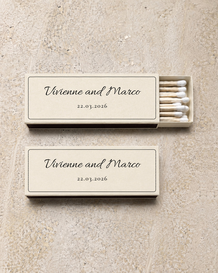 Flint slim matchbox in ivory, open and closed pair on stone