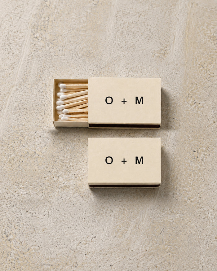 Emblem classic matchbox in ivory, open and closed pair on stone