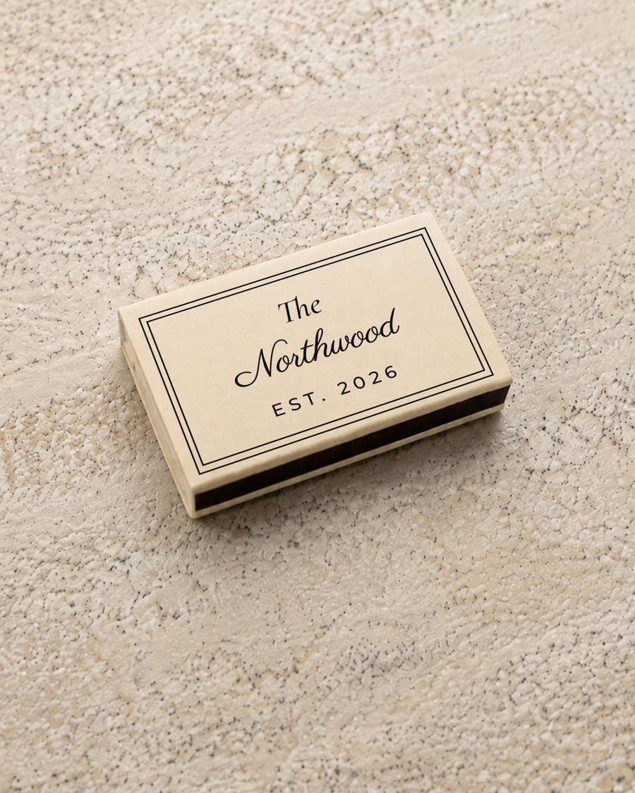 Northwood classic matchbox in ivory, closed at an angle on stone