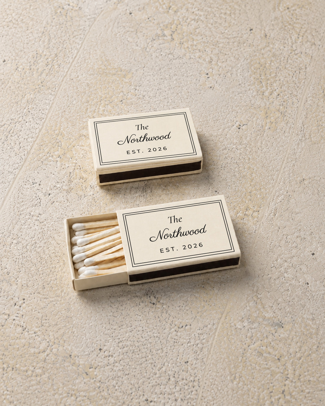 Northwood classic matchbox in ivory, angled open and closed pair on stone