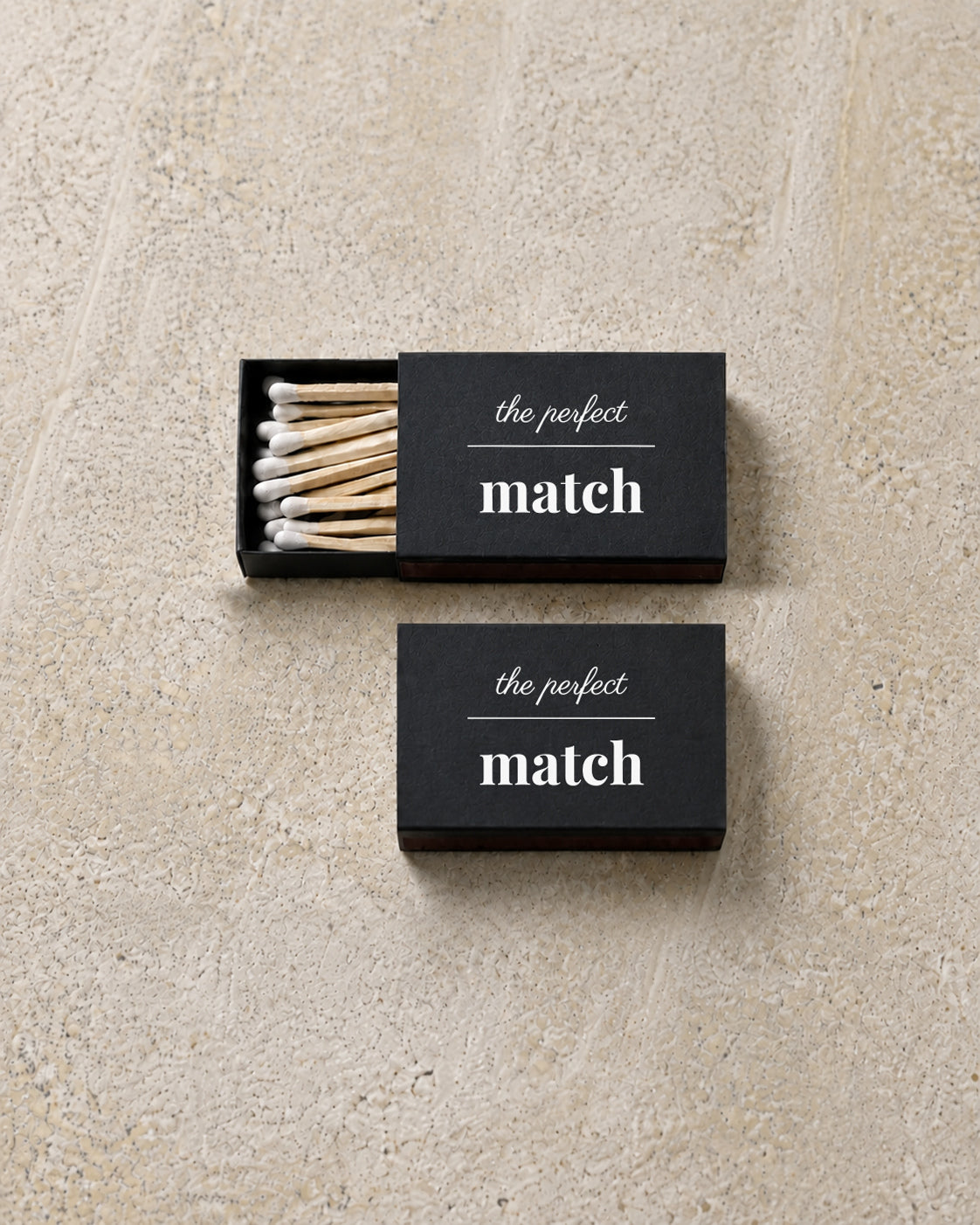 Marlowe classic matchbox in black, open and closed pair on stone