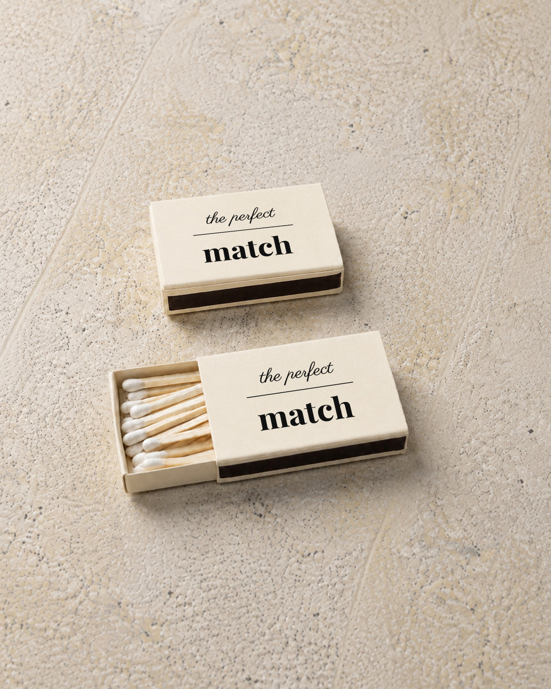 Marlowe classic matchbox in ivory, angled open and closed pair on stone
