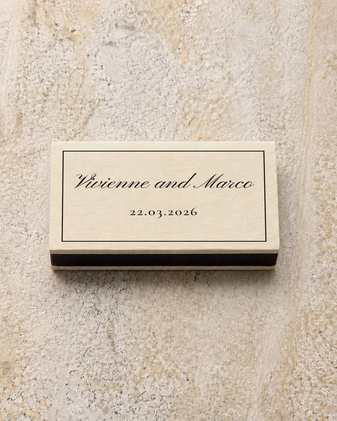 Vivienne classic matchbox in ivory, closed on stone