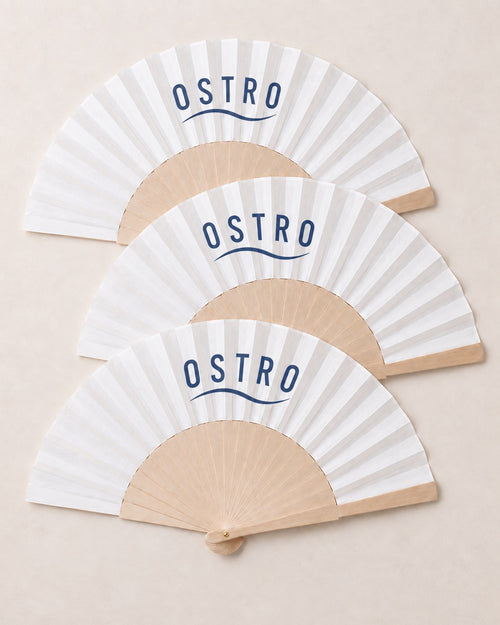 Three branded fans with a navy wordmark on white leaves, an example brand