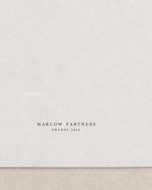 Close view of the black ink mark on a branded cocktail napkin