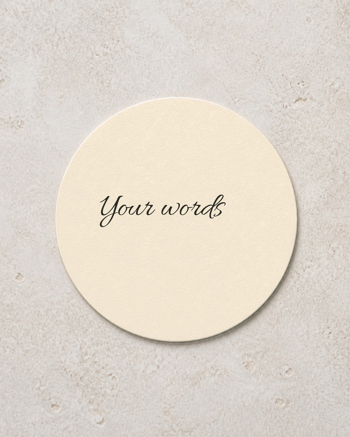 A blank wedding coaster printed with the words Your words, ready for your own wording