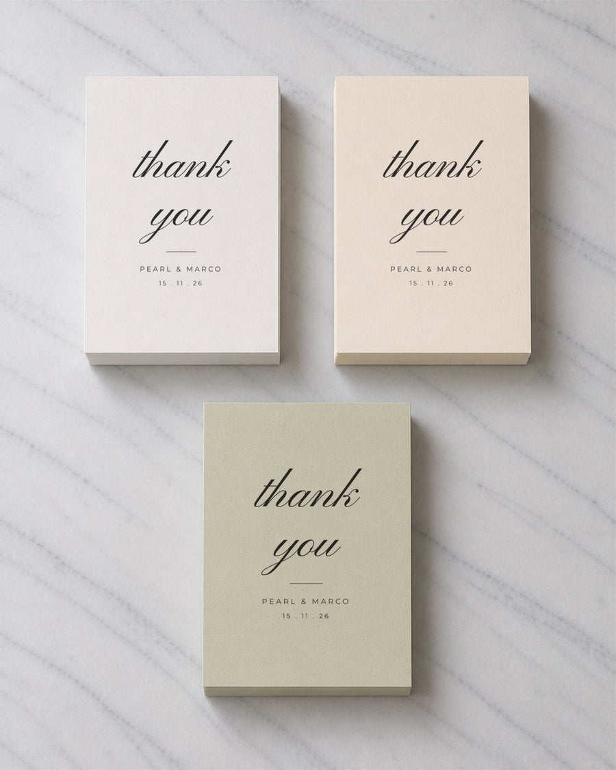 Three stacks of Wildflower Script thank you cards in Porcelain, Ivory and Sage Green