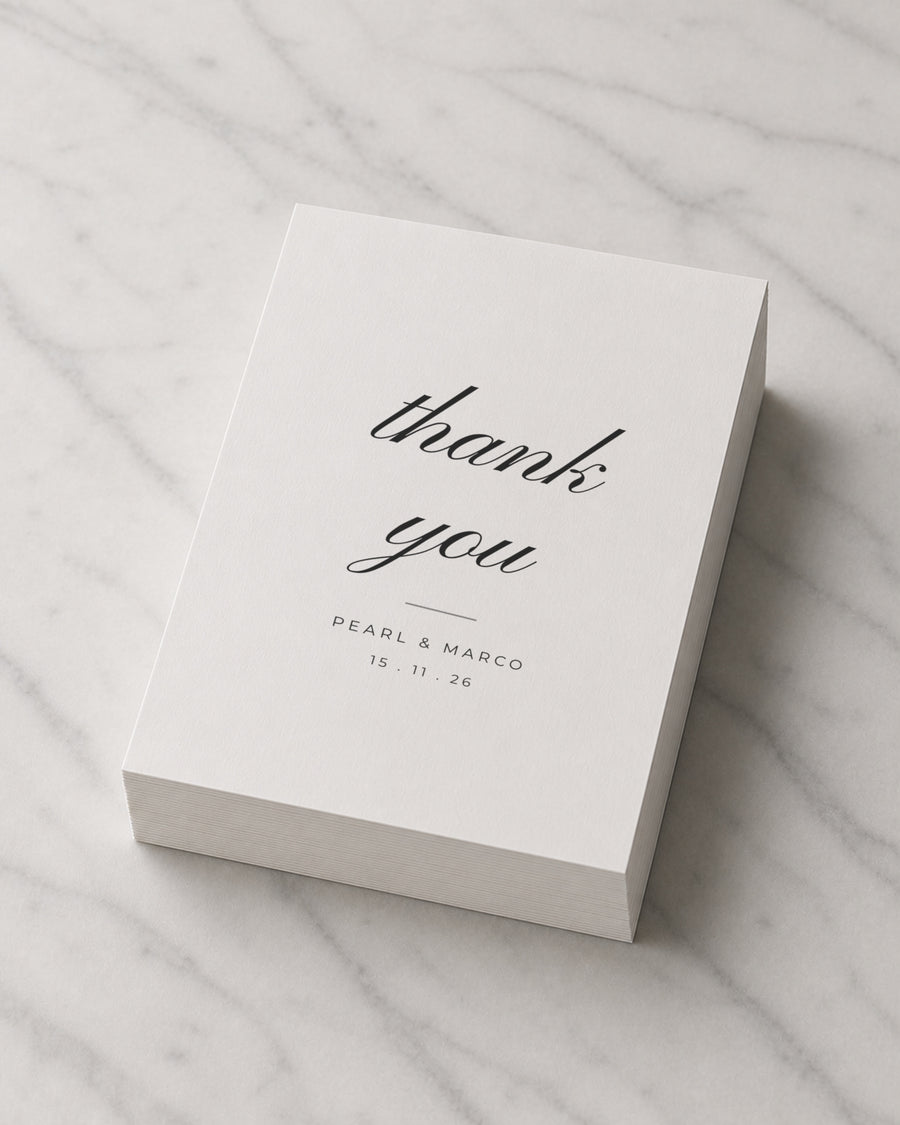 A thick stack of Wildflower Script thank you cards on marble