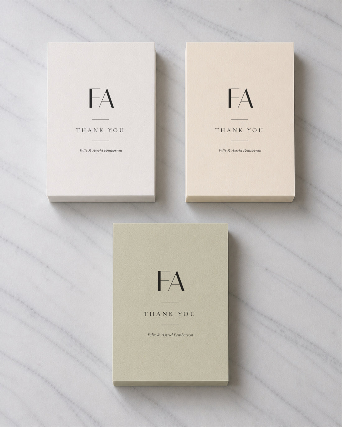 Three stacks of Marchmont thank you cards in Porcelain, Ivory and Sage Green