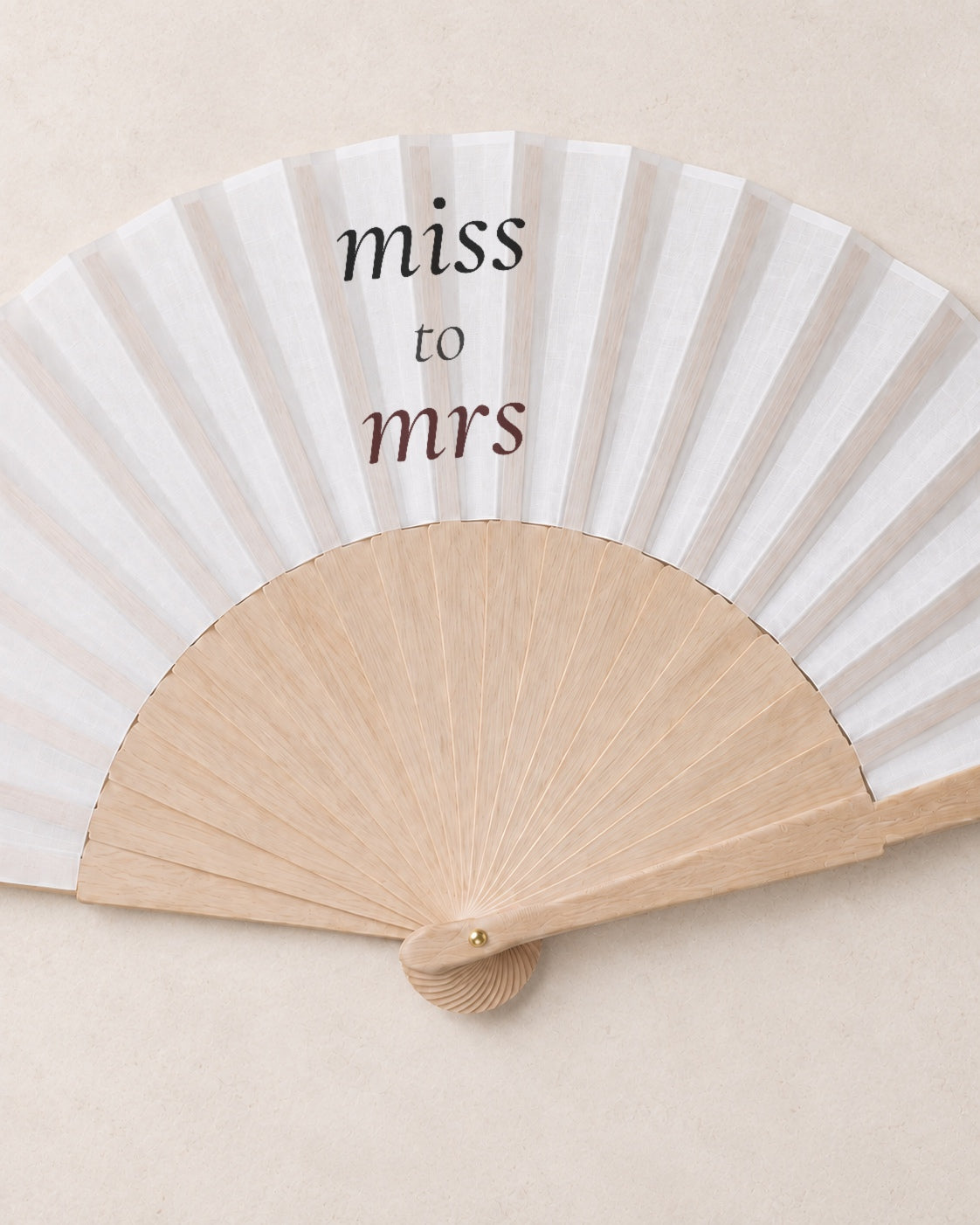 Miss to Mrs, close open fan, solid bamboo fan on light marble