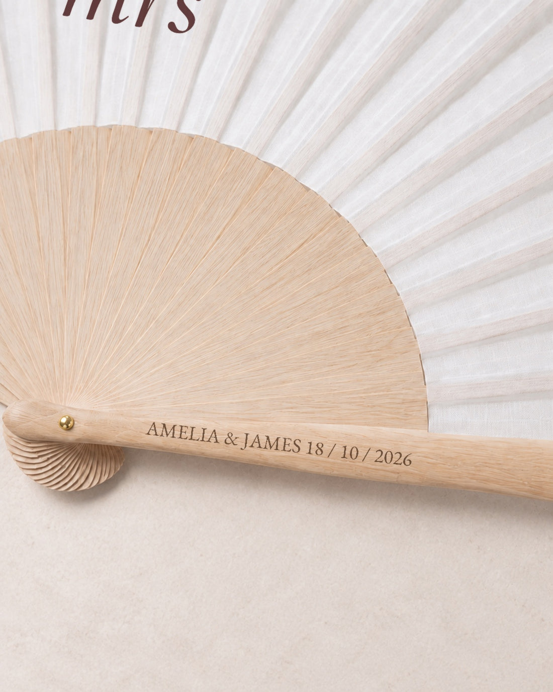 Miss to Mrs, engraving detail, solid bamboo fan on light marble