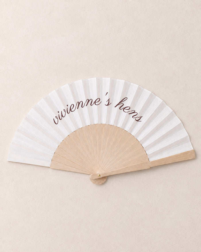 The Hen, hero, solid bamboo fan on light marble
