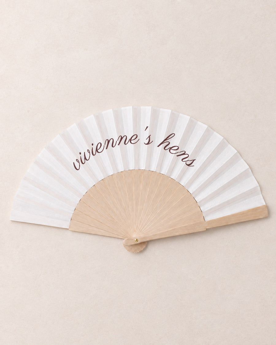 The Hen, hero, solid bamboo fan on light marble
