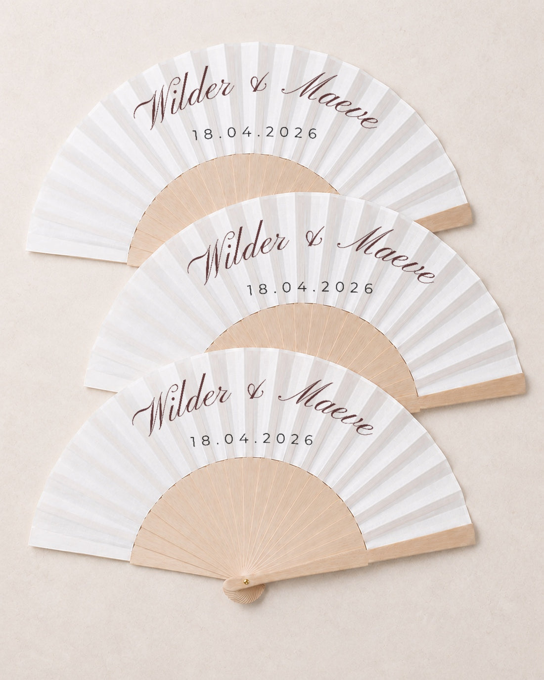 Wilder, three open fans, solid bamboo fan on light marble