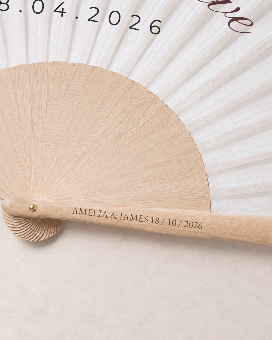 Wilder, engraving detail, solid bamboo fan on light marble