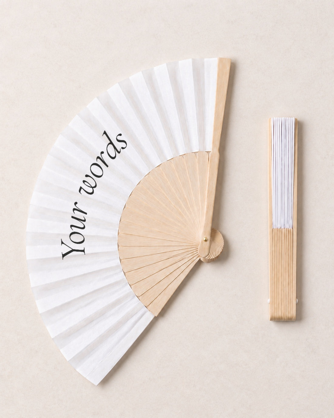 Fan Your Design (Your words), open and closed, solid bamboo fan on light marble
