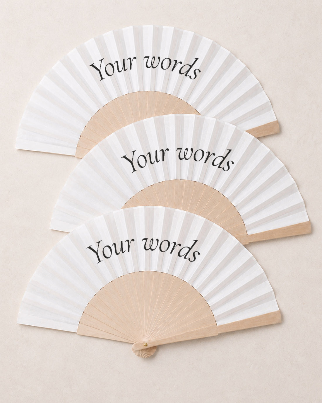 Fan Your Design (Your words), three open fans, solid bamboo fan on light marble