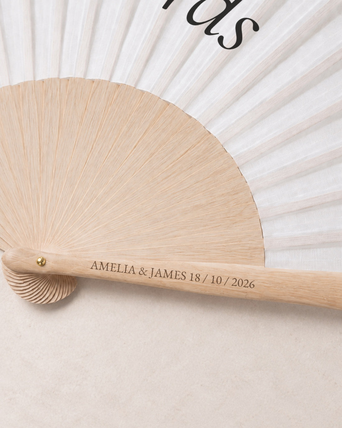 Fan Your Design (Your words), engraving detail, solid bamboo fan on light marble