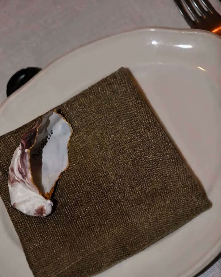 A printed menu placed on a table setting
