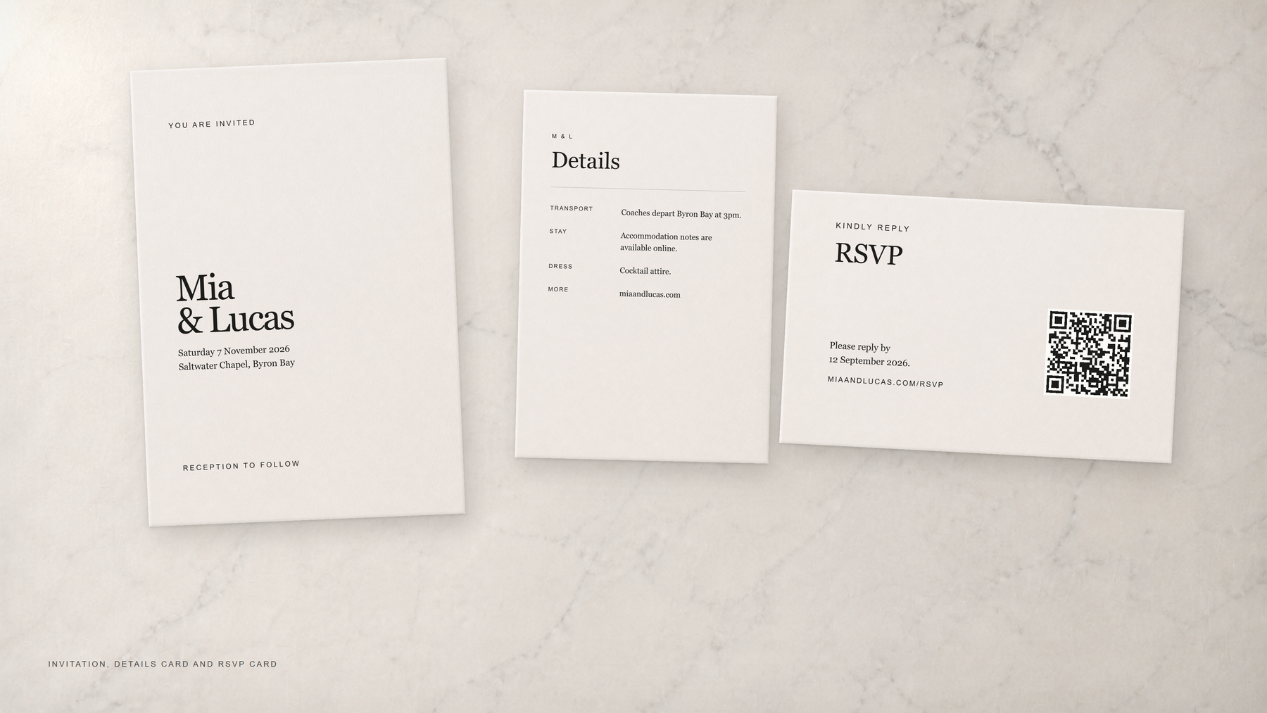 Invitation, details card and RSVP card arranged on pale marble